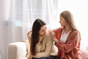 woman comforts friend in benzo addiction treatment in tennessee 